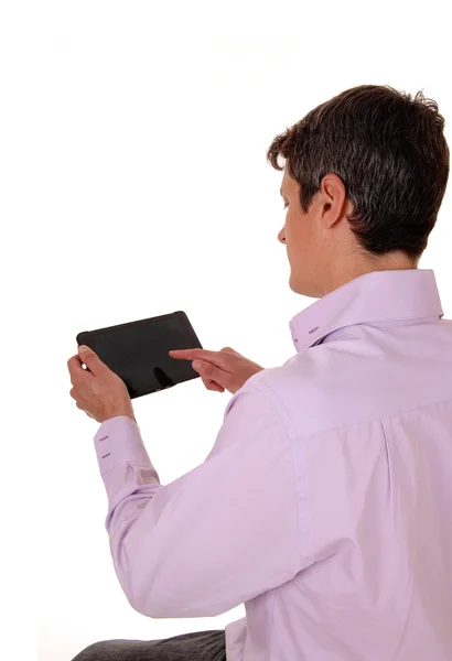 Man with tablet from back. — Stock Photo, Image