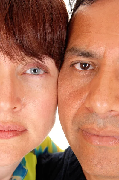 The halve faces of a middle age couple. — Stock Photo, Image