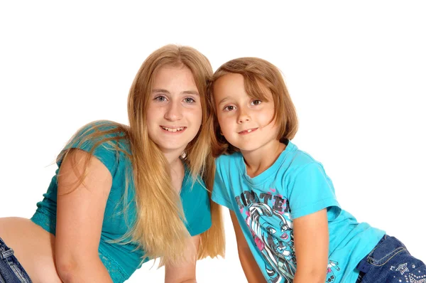 Two little sisters lying on the floor. — Stock Photo, Image