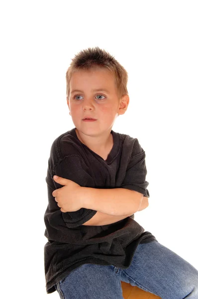 Lovely young boy hugging himself. — Stock Photo, Image