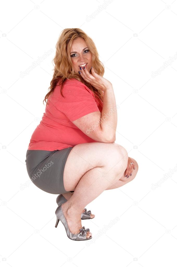 Plus size crouching in shorts and Stock Photo by ©sucher 83263076