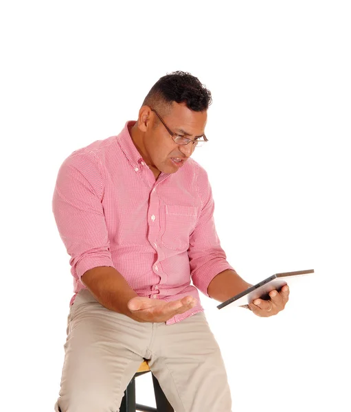 Man angry at his tablet computer. — Stock Photo, Image