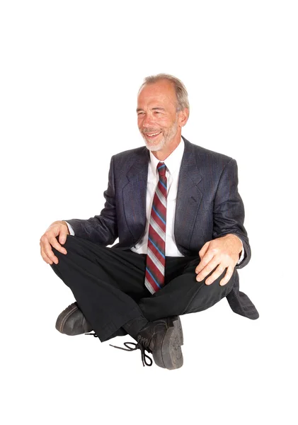 Middle age mal sitting on floor. — Stock Photo, Image