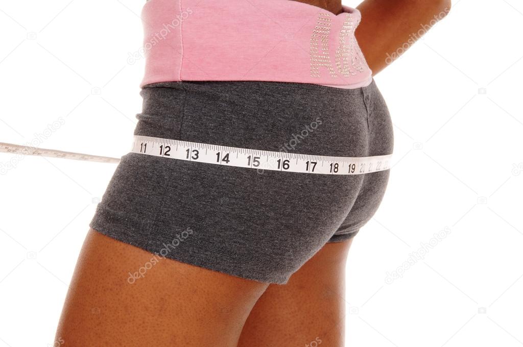 Girl measuring her butt, body part.