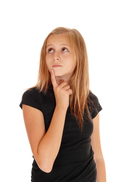 Young girl holding finger on chin. — Stock Photo, Image