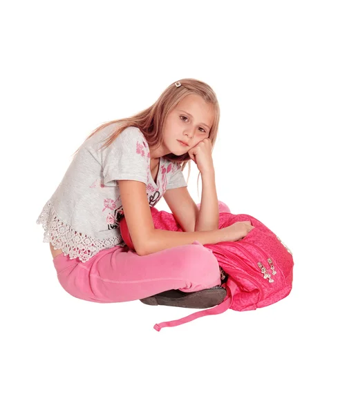 Sad looking girl with pink backpack. — Stock Photo, Image