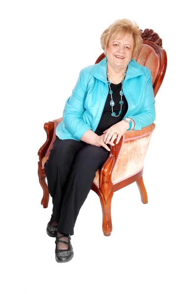 Lovely older woman in armchair. — Stock Photo, Image