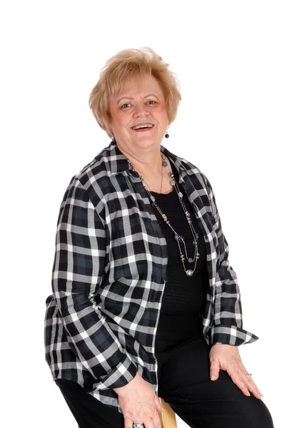 Senior woman sitting on chair. — Stock Photo, Image