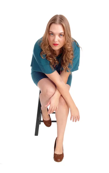 Woman sitting on chair bend forwards. — Stock Photo, Image