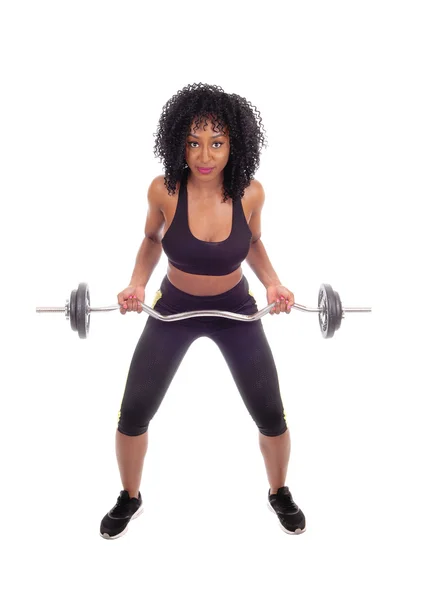 African American woman weight lifting. Royalty Free Stock Images