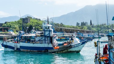 Fishing boats docked Chenggong Fishing Harbor remove fishing goo clipart