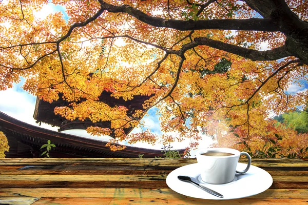 Vintage cup on wooden table — Stock Photo, Image