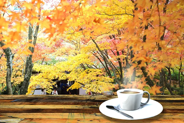 Vintage cup on wooden table — Stock Photo, Image