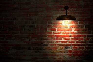 Old interior room with brick wall and three light spots clipart