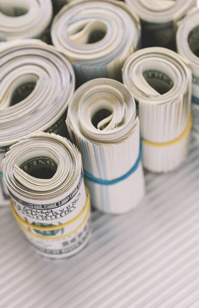 Rolls of US one hundred dollar bills — Stock Photo, Image
