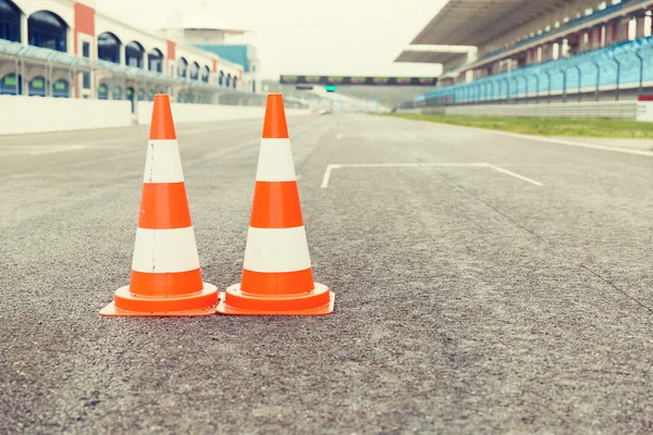 Traffic cones on speedway of stadium — Stock Photo, Image