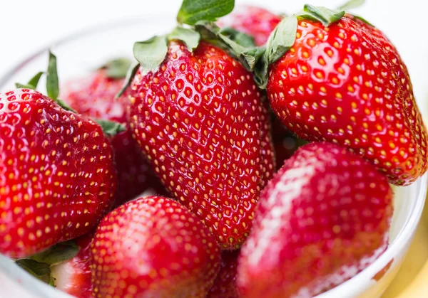 Close up of ripe red strawberries over white — Stock Photo, Image