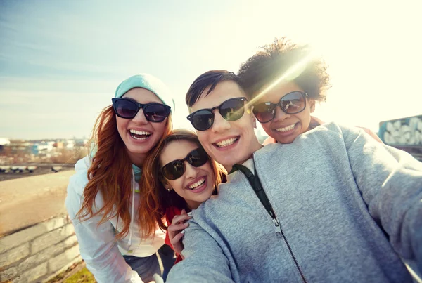 Group of happy friends taking selfie on street Royalty Free Stock Photos