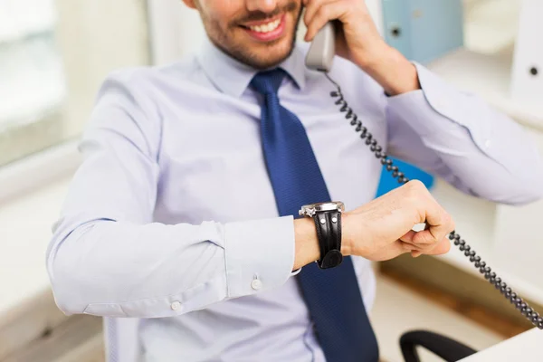 Businessman dialing number and calling on phone — Stock Photo, Image