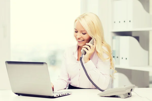 Smiling businesswoman or student calling on phone — Stock Photo, Image