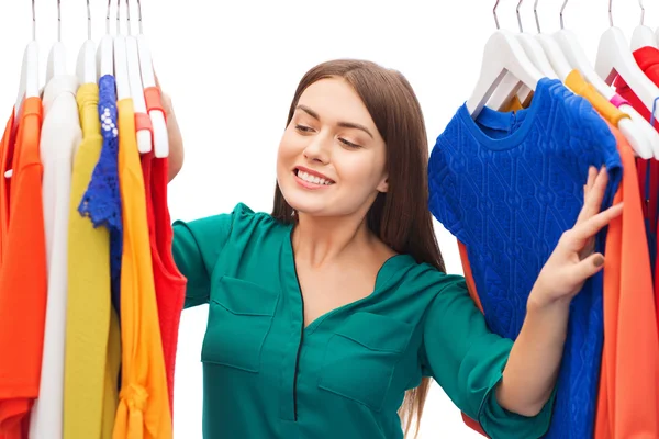 Happy woman choosing clothes at home wardrobe — Stock Photo, Image