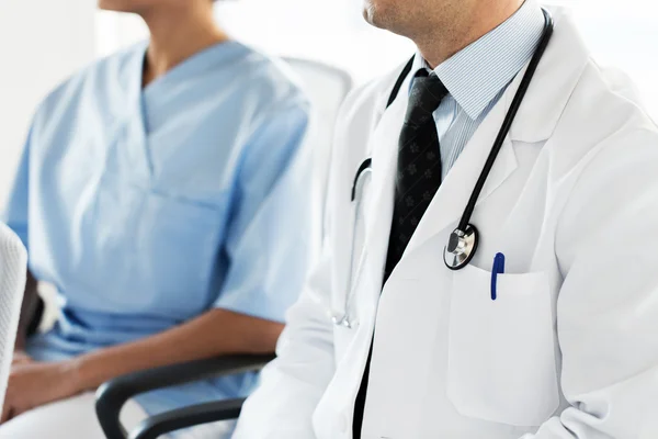 Close up of happy doctors at seminar or hospital — Stock Photo, Image