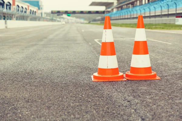 Traffic cones on speedway of stadium — Stock Photo, Image
