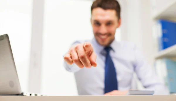 Smiling businessman pointing on you in office — Stock Photo, Image