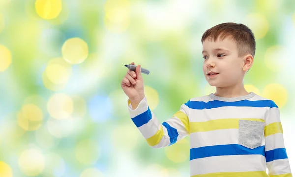 Little boy drawing or writing with marker — Stock Photo, Image