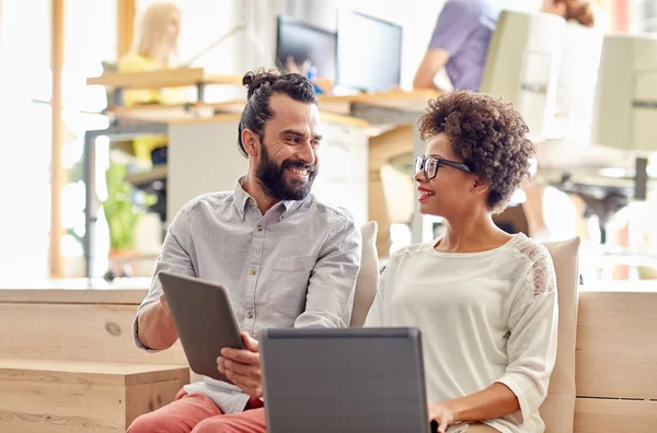 Creative team with laptop and tablet pc in office — Stock Photo, Image