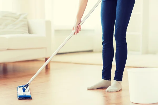 Close up of woman with mop cleaning floor at home — Stock Photo, Image