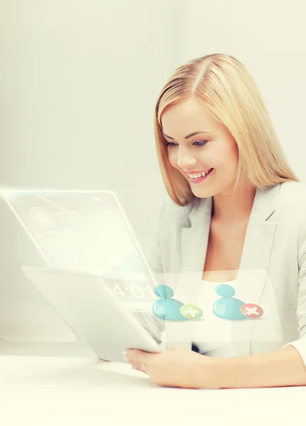 Businesswoman looking at tablet pc — Stock Photo, Image