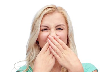 young woman or teenage girl closing her nose clipart