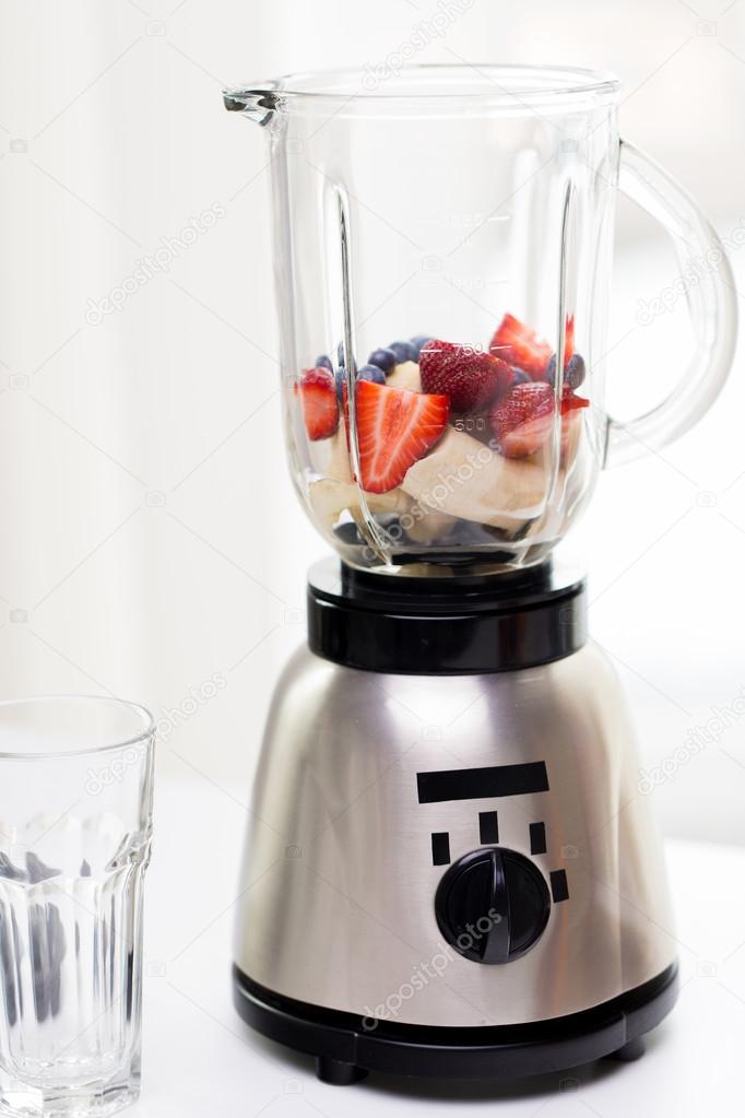 Close up of blender shaker with fruits and berries Stock Photo by  ©Syda_Productions 101358542