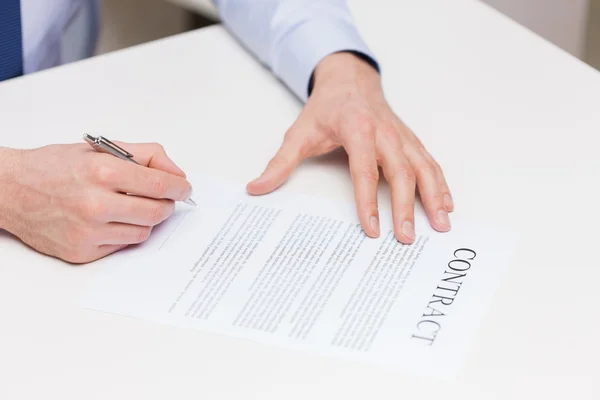 Close up of male hands signing contract document — Stock Photo, Image