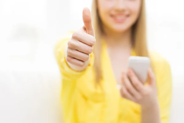 Close up of woman with smartphone at home — Stock Photo, Image