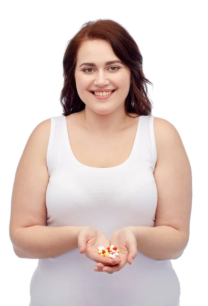 Glada plus size kvinna i underkläder med piller — Stockfoto