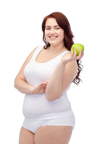 Happy plus size woman in underwear with apple — Stock Photo, Image