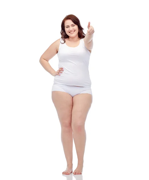 Plus size woman in underwear showing thumbs up Stock Photo