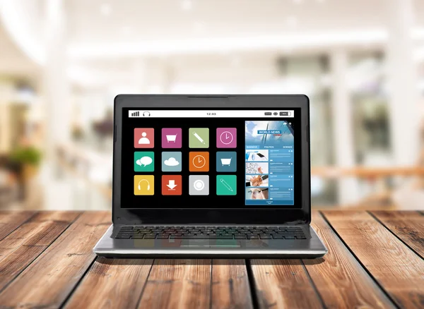 Laptop computer with application icons on screen — Stock Photo, Image