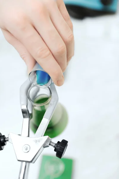 Close up of scientist filling test tubes in lab — Stock Photo, Image