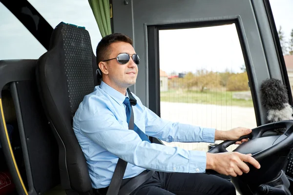 Happy driver driving intercity bus — Stock Photo, Image