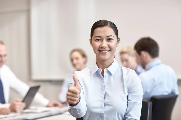 Group of smiling businesspeople meeting in office — Stock Photo, Image