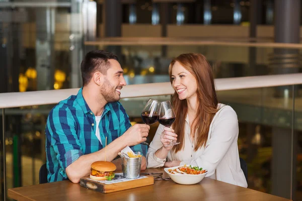 Happy couple dining and drink wine at restaurant — Stock Photo, Image