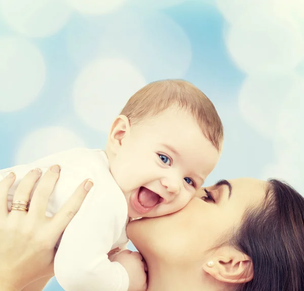 Laughing baby playing with mother — Stock Photo, Image