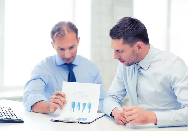 Businessmen with notebook on meeting — Stock Photo, Image