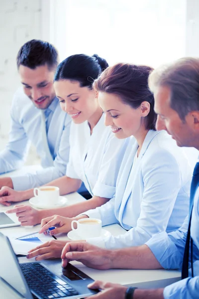 Group of people working with laptops in office — Stock Photo, Image