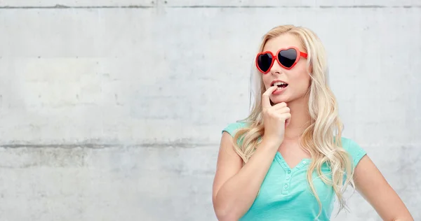 Happy young blonde woman or teenager in sunglasses — Stock Photo, Image