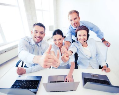 group of office workers showing thumbs up clipart