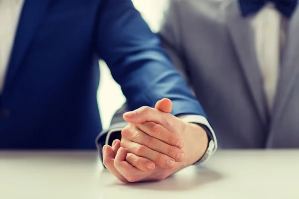 Close up of happy male gay couple holding hands — Stock Photo, Image